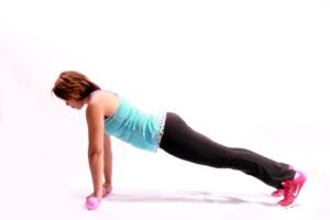 beginner woman doing strength training with dumbbells at home