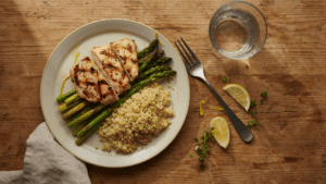 balanced plate with grilled protein, vegetables, and a whole grain, styled as a simple lunch
