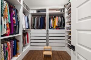 organized bedroom closet with labeled zones for clothing, shoes, and accessories, placement: Kitchen Bedroom Closet section
