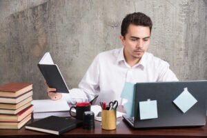 person filing LLC formation documents at a laptop